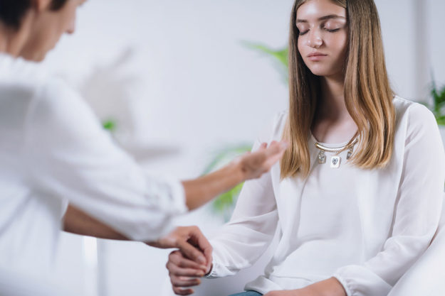 woman thinking about what does holistic treatment mean